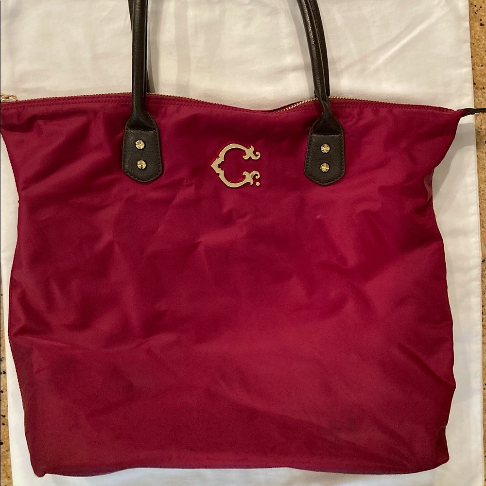 C. Wonder burgundy vinyl tote
